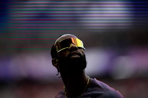 Freddie Crittenden competes during a heat in the men's 110-meter hurdles
